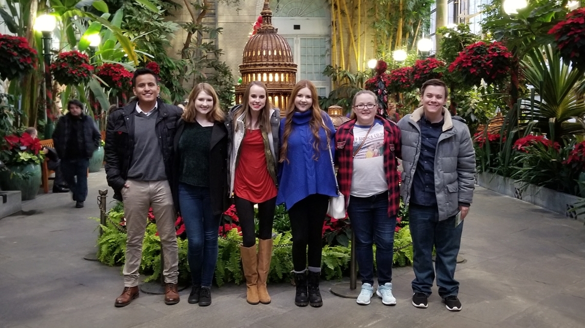Six JSU students pose in front of a model of the US Capitol at the US Botanical Gardens